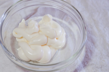 a glass bowl with mayonnaise