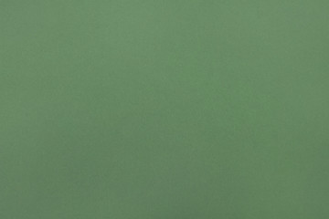 Kraft paper texture. Green background. Blank sheet of green kraft paper