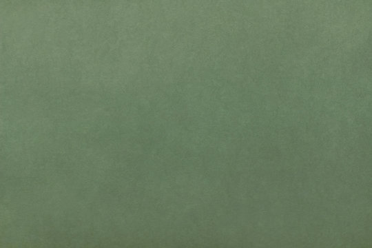 Kraft paper texture. Green background. Blank sheet of green kraft paper
