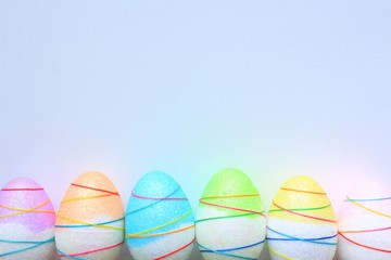 colorful easter eggs on green background