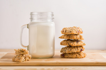 cookies and milk on wooden table