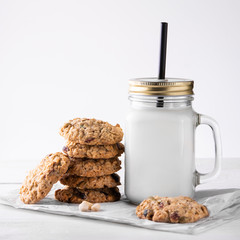 oatmeal cookies with milk on a light background