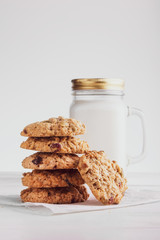 Fototapeta na wymiar oatmeal cookies with milk on a white background