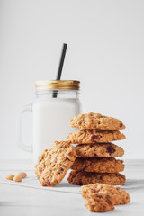 oatmeal cookies with milk on a light background
