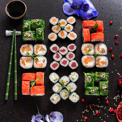 Rainbow Sushi Roll with salmon, eel, tuna, avocado, royal prawn, cream cheese Philadelphia