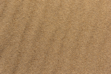 textured yellow sand on the seashore