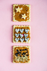 Delicious Toast with peanut butter on the pink background