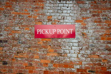 pick up point sign on old brick wall for oldies and silver foxes or just a dating site