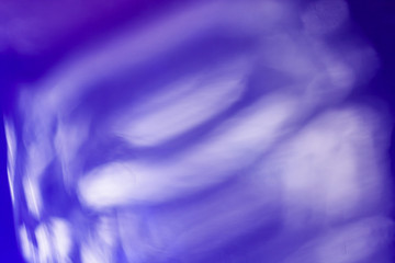 blurred white reflections over blue, abstract background