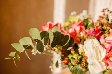 lush bouquet with berries and daisies in sunlight