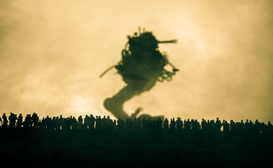 Blurred silhouette of giant monster prepare attack crowd during night. Selective focus.