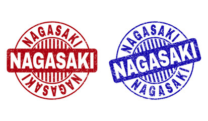 Grunge NAGASAKI round stamp seals isolated on a white background. Round seals with grunge texture in red and blue colors. Vector rubber imprint of NAGASAKI caption inside circle form with stripes.