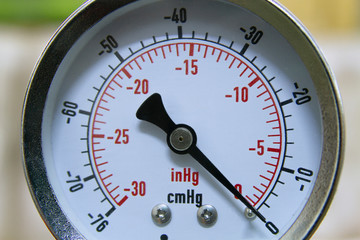 Vacuum pressure gauge meter in a close-up picture