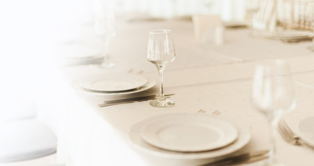 Photo of clean, and bright sets, ready for wedding party on the table