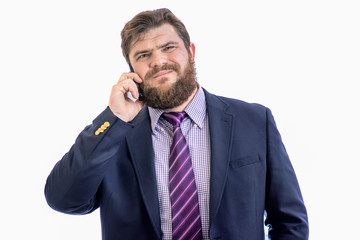 Naklejka premium big handsome upset bearded business man using mobile smart phone, isolated on white