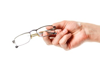Fototapeta na wymiar Hand holding glasses for vision correction. Close up. Isolated on white background