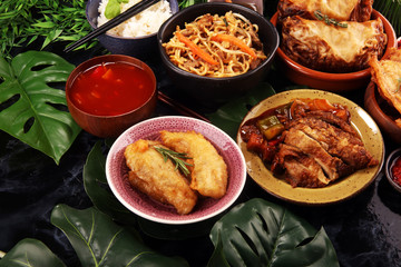 Assorted Chinese food set. Chinese noodles, fried rice, peking duck, dim sum, spring rolls. Famous...