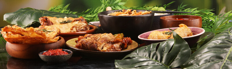 Assorted Chinese food set. Chinese noodles, fried rice, peking duck, dim sum, spring rolls. Famous Chinese cuisine dishes on table. Chinese restaurant concept. 