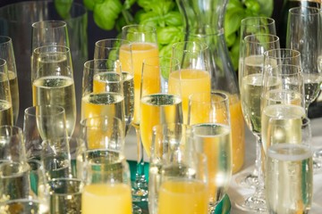 Luxury welcome drink champagne at gala party success celebration. Mixed glasses with orange juice to celebrate launch event wedding, business meeting or anniversary by restaurant catering service