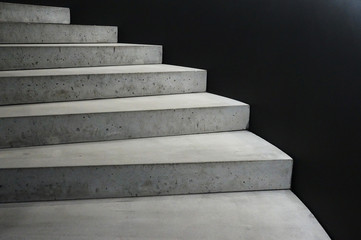 Concrete stairway black background. Abstract architecure. Abstractive background