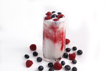 yogurt with red berries on white background