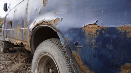 Rusty blue car