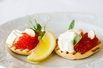 sandwiches with cheese and red trout caviar