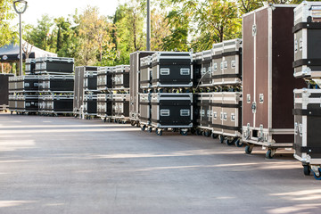 Concert containers. Boxes for equipment. Preparing the stage for a concert in the open air.