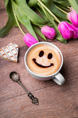 A cup of coffee laughs