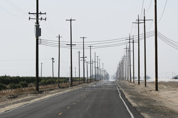 Extreme heat causes mirage down an endless desert road in California