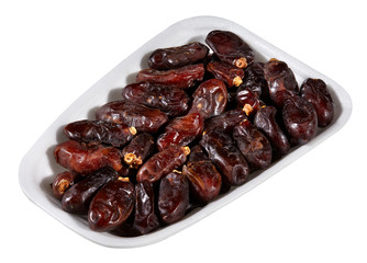 dried dates,plastic tray of dried dates isolated on white background