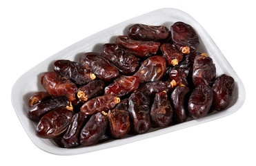 dried dates,plastic tray of dried dates isolated on white background