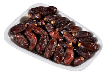 dried dates,plastic tray of dried dates isolated on white background
