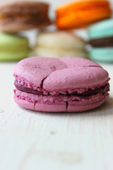 French sweet delicacy, macaroons variety close-up.Macaroons cake isolated on a light background. Copy space.
