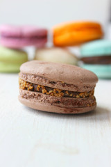 Delicious chocolate macaroon on the table. Chocolate macaroons. Copy space.