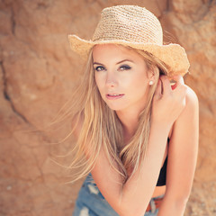 young woman in  straw hat