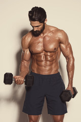 Handsome Muscular Men Exercise With Weights