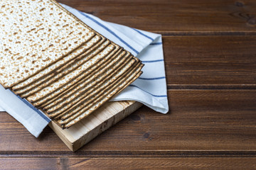 Stack of matzah or matza on a wooden  table