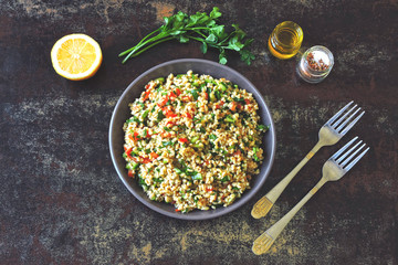 Salad tabbouleh. Healthy salad with bulgur and vegetables. Lebanese recipe. Middle Eastern cuisine.