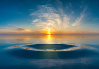 Fototapeta Sunset or sunrise over water droplet in the ocean obraz