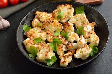 Fototapeta na wymiar Fried cauliflower with herbs and spices