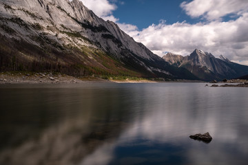 A long exposure shot of Medicine Lake, Jasper National Park, from the head of the lake, the waters of the lake are smooth due to the long exposure.