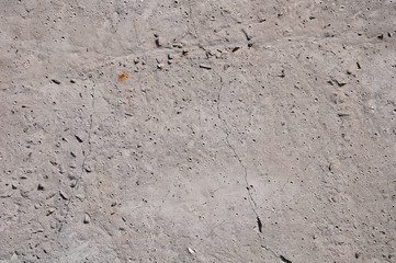 Gray concrete textures background. Cracks. Scratches. Damage. Cracked stone wall background.