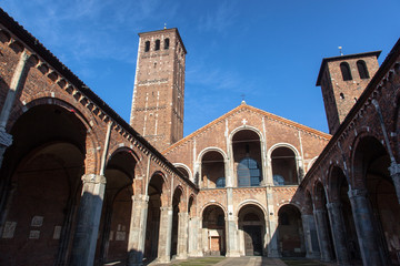 Chiesa di San'ambrogio in Milan on a sunny day, with columns and bell tower