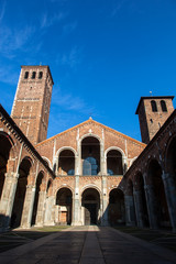 Chiesa di San'ambrogio in Milan on a sunny day, with columns and bell tower