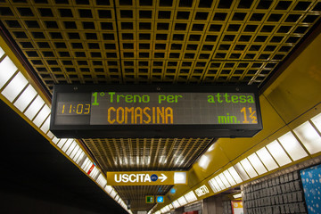 electronic sign placed on the ceiling of the Milan subway