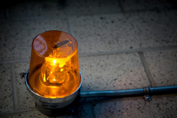 Emergency orange alert light closeup object detail concept warning 