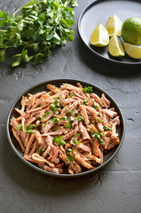 Slow cooked pulled beef for sandwiches with parsley