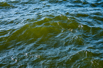 Waving clear blue sea water as a natural background.