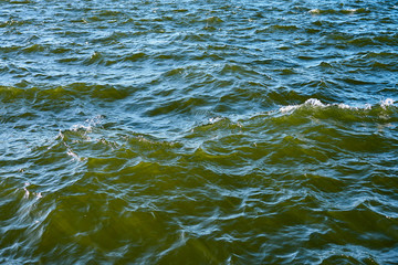 Waving clear blue sea water as a natural background.